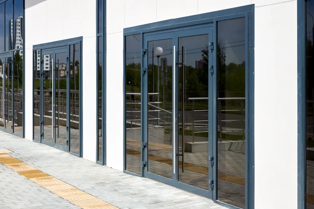 Row of aluminium framed glazed doors fitted to a modern building frontage